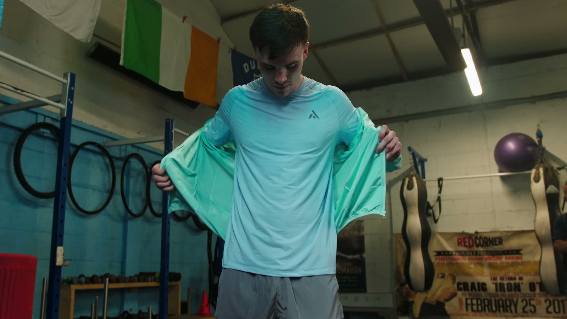 Athlete training in a boxing gym wearing PEAK performance apparel