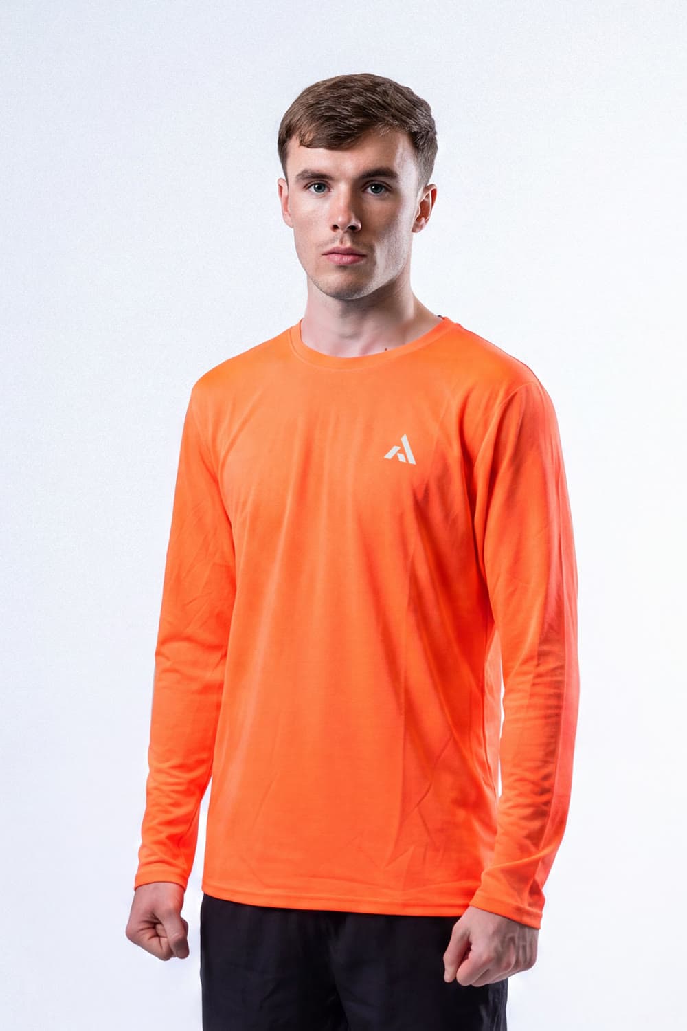 Athlete wearing the PEAK Tempo Long-Sleeve in orange
