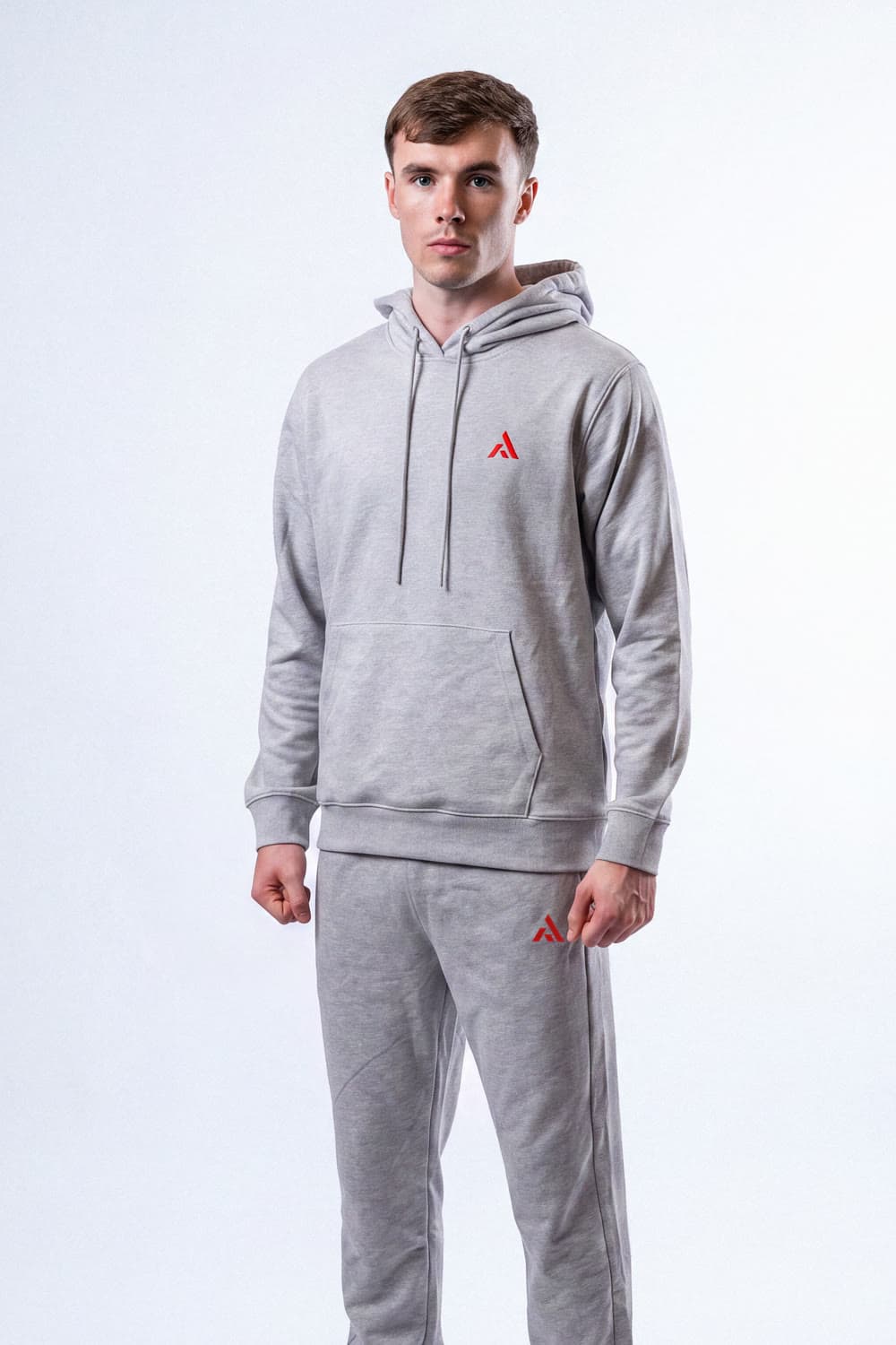 Athlete wearing the PEAK Essentials Tracksuit in grey marl