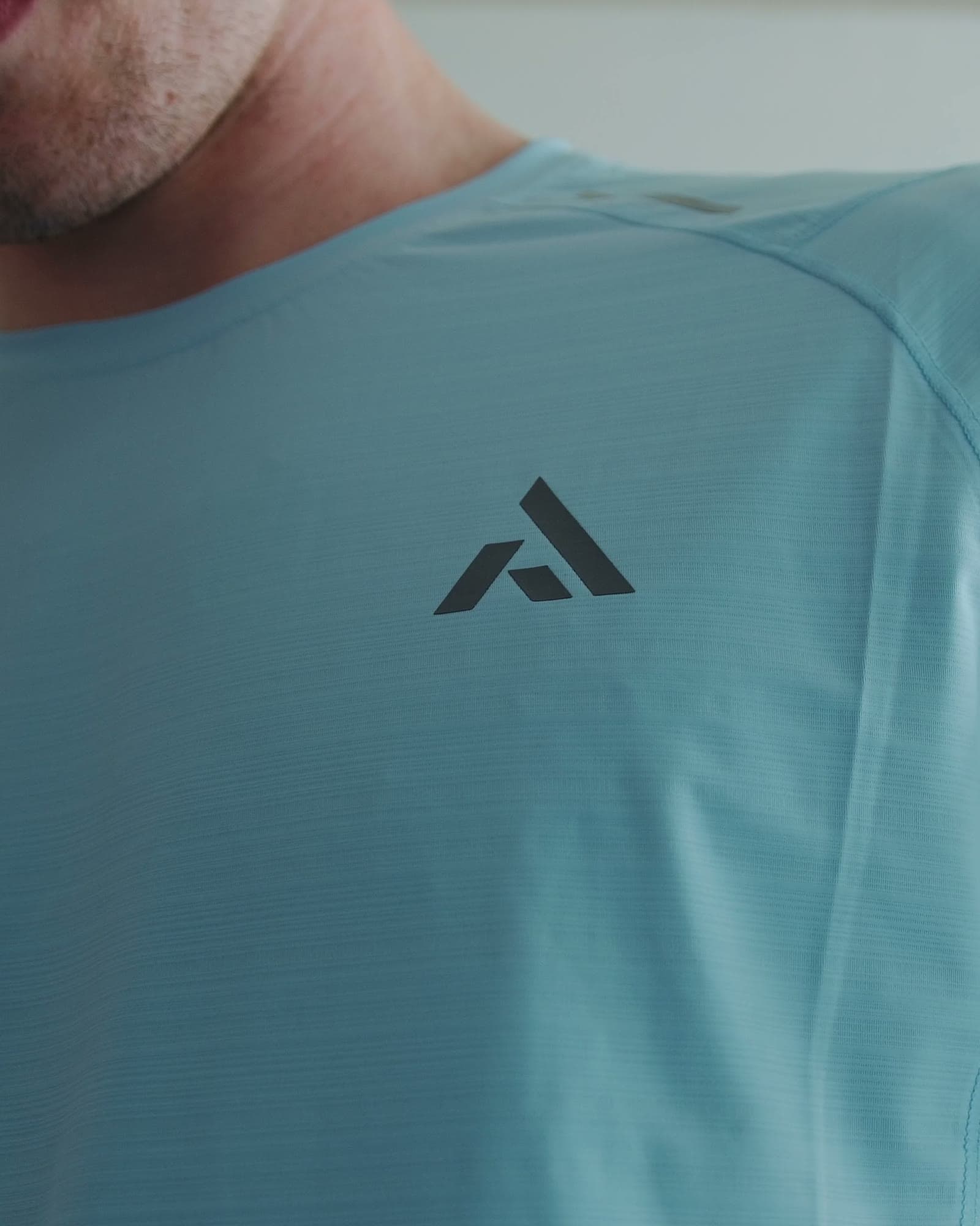Close detail of PEAK performance fabric on the body